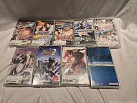 Group shot of all eight PSP game cases