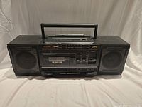 Full frontal view of the JVC PC-V33 boom box showing speakers, cassette deck and controls