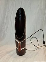 Front view showing oval opening, glaze pattern, cord