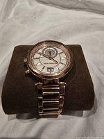 Front view of Michael Kors wristwatch on cushion