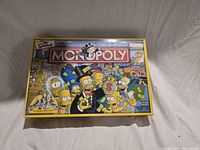 Closed box lid showing Simpsons Monopoly artwork