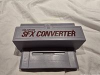 Front view of grey SFX Converter showing printed branding