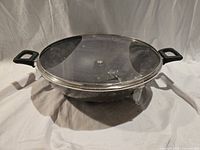 Top view of wok with lid showing handles and packaging