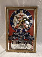 Full view showing entire Budweiser mirror clock in wood frame