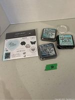 Three Distress ink pads including two Distress Oxide in blue shades and one Distress Ink in teal color.