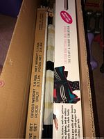 Long white cardboard box showing "LM150 Knitting Machine: The Craft & Hobby Sensation" branding