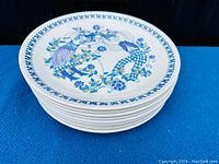 Stack of nine plates showing profile and pattern