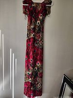 Full length of the hanging dress showing complete pattern and shape