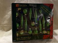 Boxed vintage green glass ornaments, hand-decorated, various shapes, original packaging