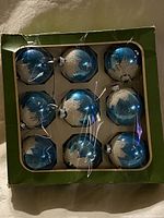 Boxed set of nine vintage blue Christmas ball ornaments with silver snowflake decoration in original Fieldcraft Canada green box.