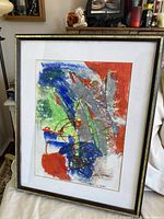 Framed abstract painting showing full artwork, colors and condition.