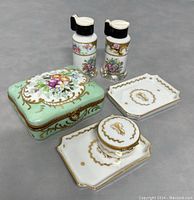 All items together showing the jewelry box, three trinket dishes, round trinket box, and salt and pepper shakers