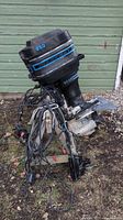 Full view of Mercury 85 HP outboard motor with attached wiring harness