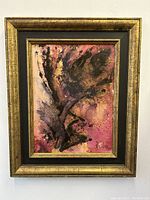 Front view of abstract oil painting showing colors, signature, and gold leaf wood frame.