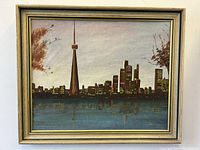 Frontal view of the oil painting showing the Toronto skyline with the CN Tower at night under a cloudy sky, including a gold frame.