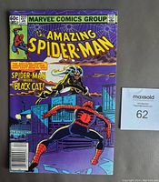 Front cover photo showing Spider-Man and Black Cat on a rooftop at night, issue #227 from April 1982, price marked 60 cents.