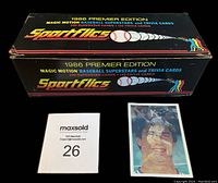 Closed box of Sportflics 1986 Premier Edition with one card standing next to the box and a MaxSold lot tag.