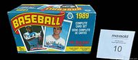 Opened factory box showing front graphic with baseball card player images and factory labeling for 1989 complete baseball card set.