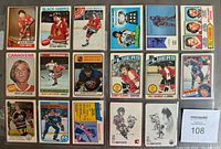 Photo showing 17 various vintage hockey cards arranged flat, featuring notable players including Stan Mikita, Guy Lafleur, Mark Messier, and more from NHL teams such as Chicago Black Hawks, Montreal Canadiens, Edmonton Oilers.
