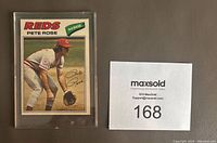 Front of Pete Rose 1977 O.P.C. baseball card #240 in protective sleeve with maxsold lot number.