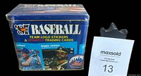 Front view of sealed tin showing '87 Fleer Baseball branding and player images including Paul Molitor and Reggie Jackson