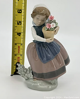 Front view of the Lladro porcelain figurine with a measuring tape showing a height of approximately 6.5 inches.
