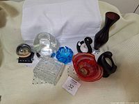 Photo of all glass, wooden, and decorative items in lot.