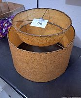 Overall image showing the two-tier textured lamp shade with wire frame. Lower tier is larger diameter, upper tier smaller and supported by wire struts.