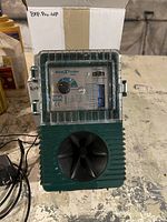 Front view of one Bird-X bird repeller unit including control panel, dial, and speaker horn, with a box in the background.