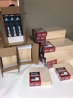 First image showing stacked new Blick Premier wood panel blocks in original boxes and loose, various sizes visible.