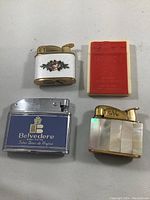 Top-down view of the four lighters to show overall appearance and designs.