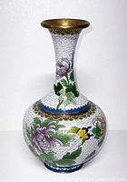 Side view of the first Chinese cloisonné vase showing chrysanthemum flowers and a bee with gold rims.