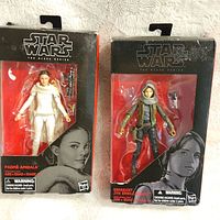 Both Star Wars Black Series figures in original packaging side by side, showing Padmé Amidala in white and Sergeant Jyn Erso in hooded outfit.