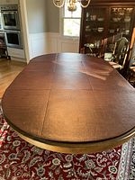 Top view of table surface with leaves installed showing finish and leaf seams