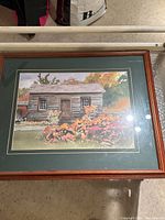 Framed watercolor painting showing The Thomas Maxwell House with a wooden frame and green double mat.