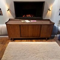 Wide view of console stereo with top closed for size and environment context