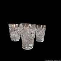 Three Webb Corbett crystal juice glasses grouped showing cut pattern and clarity