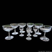 Group image of all 9 vintage crystal wine glasses showing two sizes and overall shape and design.