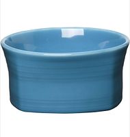 Side profile of the square ceramic cereal bowl showing peacock blue glaze and shape