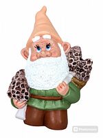 Full view of the hand-painted ceramic garden gnome figurine standing and holding pine cones