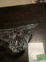 Crystal bowl viewed from the side showing detailed cut star and fan patterns and rim curvature