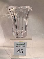 Front view of Daum crystal vase with four rounded lobes and clear transparent crystal showing thickness and weight.
