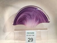 Front angle showing fan-shaped purple and pink Murano glass holder with clear glass encasing