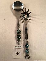 Photo showing salad fork and spoon with aluminum wire wrap and colored glass beads on handles, new condition.