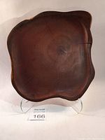 Top view showing the smooth, polished surface, wood grain, and natural cracks.