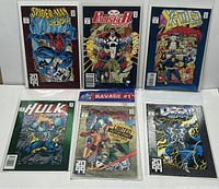 Photo showing all 6 Marvel 2099 comics including Spider-Man 2099, The Punisher 2099, X-Men 2099, Hulk 2099, Ravage 2099 (sealed with limited out-of-print label), and Doom 2099 #1 issues arranged on a flat surface.