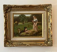 Full view of framed painting hung on wall showing ornate gilt frame and pastoral scene