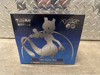 Photo of the sealed Pokémon GO Elite Trainer Box featuring Mewtwo on a blue background with Pokémon and Pokémon GO logos.