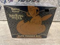 Front view of sealed Pokémon Shining Fates Elite Trainer Box with Eevee artwork.