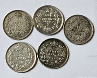 Five Canadian silver dimes showing reverse sides with dates 1902, 1912 and 1918.